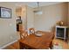 Dining area with wood table, decorative rug, and view to the kitchen at 5113 Lady Of The Lake Dr, Raleigh, NC 27612
