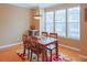 Charming dining area with wood table, decorative rug, and plenty of natural light at 5113 Lady Of The Lake Dr, Raleigh, NC 27612