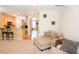Open concept living space with bar seating and view into kitchen and dining areas at 5113 Lady Of The Lake Dr, Raleigh, NC 27612