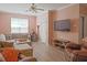 Comfortable living room with hardwood floors, large sofa, and natural light at 5113 Lady Of The Lake Dr, Raleigh, NC 27612