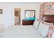 Comfortable main bedroom with colorful floral wall covering and ensuite bath access at 5113 Lady Of The Lake Dr, Raleigh, NC 27612