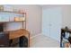 Home office with a desk, cabinets, and a large window at 5113 Lady Of The Lake Dr, Raleigh, NC 27612
