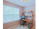 Home office with a desk, large window, and a chair at 5113 Lady Of The Lake Dr, Raleigh, NC 27612