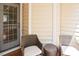 Cozy patio with wicker chairs and a side table, perfect for enjoying the outdoors at 5113 Lady Of The Lake Dr, Raleigh, NC 27612