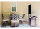 Outdoor patio with dining set and grill, perfect for entertaining guests at 5113 Lady Of The Lake Dr, Raleigh, NC 27612
