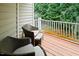 Inviting outdoor patio with wicker seating and wooded views, ideal for relaxation at 5113 Lady Of The Lake Dr, Raleigh, NC 27612