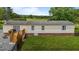 View of the house and large yard area, including the wooden deck at 5200 Mrs Fuller Rd, Mebane, NC 27302