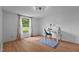 Bedroom boasts a sleek desk, cozy blue rug, and window letting in natural light with stylish curtains at 5200 Mrs Fuller Rd, Mebane, NC 27302