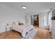 Bedroom features wood floors and an attached bathroom at 5200 Mrs Fuller Rd, Mebane, NC 27302