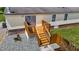 Exterior view of a well-maintained wooden deck with access to the backyard area at 5200 Mrs Fuller Rd, Mebane, NC 27302