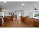 Spacious kitchen with wood cabinets, granite countertops, and an open floor plan for easy entertaining at 5200 Mrs Fuller Rd, Mebane, NC 27302