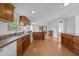 Eat-in kitchen includes wood cabinets, granite countertops, white appliances, and an open concept design at 5200 Mrs Fuller Rd, Mebane, NC 27302