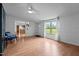 View of a living room with wood look floors, lots of light from the window, and an open concept layout at 5200 Mrs Fuller Rd, Mebane, NC 27302