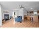 Open concept living room features a fireplace and view into the kitchen at 5200 Mrs Fuller Rd, Mebane, NC 27302