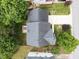 An aerial view shows the roof, driveway, and well manicured yard of a beautiful home at 5942 Big Nance Dr, Raleigh, NC 27616
