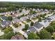 Aerial view of a suburban neighborhood with many homes and mature trees at 5942 Big Nance Dr, Raleigh, NC 27616