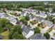 An aerial view of a suburban neighborhood shows many homes and mature trees at 5942 Big Nance Dr, Raleigh, NC 27616