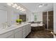 Primary bathroom featuring a soaking tub, tiled shower, double sink vanity, and tile floor at 5942 Big Nance Dr, Raleigh, NC 27616