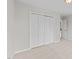 Neutral bedroom featuring a closet with four bi-fold doors and neutral walls and carpet at 5942 Big Nance Dr, Raleigh, NC 27616