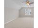 Bonus room with neutral walls and carpet, a ceiling fan with light, and one window at 5942 Big Nance Dr, Raleigh, NC 27616