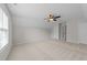 Bonus room with neutral walls and carpet, a ceiling fan with light, and multiple closets at 5942 Big Nance Dr, Raleigh, NC 27616