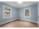 Bright bedroom featuring two large windows at 601 Acorn St, Burlington, NC 27215
