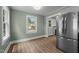 Dining area featuring lots of natural light from windows and stainless steel refrigerator at 601 Acorn St, Burlington, NC 27215