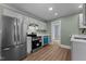 Modern kitchen featuring stainless steel appliances and white cabinetry at 601 Acorn St, Burlington, NC 27215