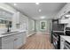 Updated kitchen with modern appliances, ample counter space, and lots of windows at 601 Acorn St, Burlington, NC 27215
