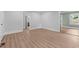Spacious living room with freshly painted walls and hardwood floors at 601 Acorn St, Burlington, NC 27215