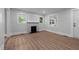 Cozy living room featuring neutral walls, classic trim and durable flooring at 601 Acorn St, Burlington, NC 27215