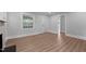 Bright living room offering hardwood floors and updated paint at 601 Acorn St, Burlington, NC 27215