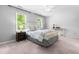 Bright bedroom with a large bed, modern decor, and two windows providing natural light at 6104 New Market Way, Raleigh, NC 27609