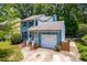 Charming two-story home boasts a well-manicured lawn, attached garage, and lovely curb appeal at 6104 New Market Way, Raleigh, NC 27609