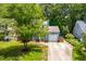Welcoming home with a well-maintained lawn, an attached garage, and a neatly landscaped yard enhancing its charm at 6104 New Market Way, Raleigh, NC 27609