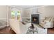Cozy living room featuring hardwood floors, a fireplace, and access to an outdoor deck at 6104 New Market Way, Raleigh, NC 27609