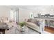 Comfortable living room next to the kitchen featuring hardwood floors and a decorative fireplace at 6104 New Market Way, Raleigh, NC 27609