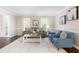 Comfortable living room features hardwood floors, neutral paint, and an open layout perfect for relaxing at 6104 New Market Way, Raleigh, NC 27609