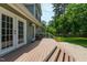 Inviting backyard deck with access to outdoor seating and a lush green yard at 7009 Brecken Ridge Ave, Raleigh, NC 27615