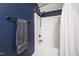 Bathroom featuring white shower and blue painted walls at 7009 Brecken Ridge Ave, Raleigh, NC 27615