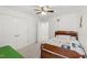 Comfortable bedroom with carpet, large closet, and a brightly colored quilt at 7009 Brecken Ridge Ave, Raleigh, NC 27615