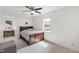 Bright bedroom featuring a ceiling fan and neutral color palette at 7009 Brecken Ridge Ave, Raleigh, NC 27615