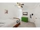 Bright bedroom featuring a ceiling fan, green dresser, and neutral color palette at 7009 Brecken Ridge Ave, Raleigh, NC 27615