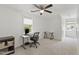 Bedroom offers natural lighting and ceiling fan, creating a functional space for work or relaxation at 7009 Brecken Ridge Ave, Raleigh, NC 27615