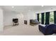 Bonus room with neutral carpeting and bright natural lighting, perfect for a lounge or recreation area at 7009 Brecken Ridge Ave, Raleigh, NC 27615