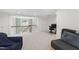 Bonus room with neutral carpeting, natural lighting and casual furnishings perfect for relaxation or entertainment at 7009 Brecken Ridge Ave, Raleigh, NC 27615