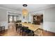 Dining room featuring wood table and floors with an open concept design at 7009 Brecken Ridge Ave, Raleigh, NC 27615