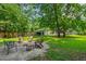 Backyard with stone fire pit area and comfortable seating, perfect for outdoor entertaining and relaxation at 7009 Brecken Ridge Ave, Raleigh, NC 27615