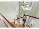 Bright foyer with a staircase with wood treads leading to the front door, showcasing the home's entrance at 7009 Brecken Ridge Ave, Raleigh, NC 27615