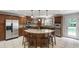 Spacious kitchen boasting granite countertops, stone backsplash and stainless appliances at 7009 Brecken Ridge Ave, Raleigh, NC 27615